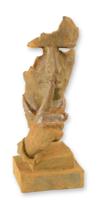A RUSTY CAST IRON STATUE OF A WHISPERING FACE A RUSTY CAST IRON STATUE OF A WHISPERING FACE