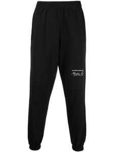 Martine Rose pantalon de jogging slim à logo imprimé - Noir