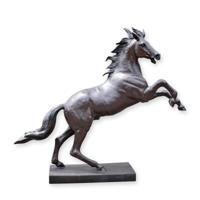 A BRONZE SCULPTURE OF A HORSE
