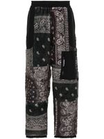 Neighborhood pantalon de jogging à imprimé bandana - Noir Neighborhood pantalon de jogging à imprimé bandana - Noir