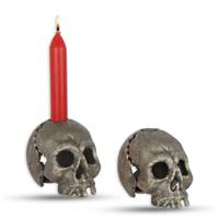 A CAST IRON SKULL CANDLE HOLDER, OLD SILVER