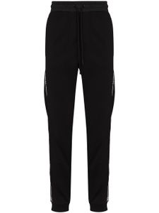 Moncler pantalon de jogging à rayures latérales - Noir