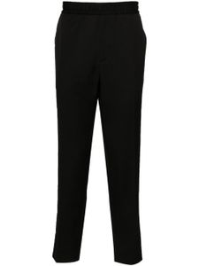 Golden Goose logo-plaque virgin wool trousers - Noir