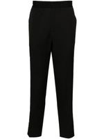 Golden Goose logo-plaque virgin wool trousers - Noir