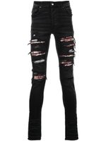 AMIRI jean skinny à finitions effilochées - Noir