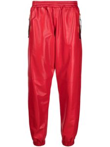 Moschino pantalon de jogging en cuir à plaque logo - Rouge