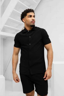 Malelions Ribbed Camp Collar Zomerset Heren Zwart - Maat S - Kleur: Zwart | Soccerfanshop Malelions Ribbed Camp Collar Zomerset Heren Zwart - Maat S - Kleur: Zwart | Soccerfanshop