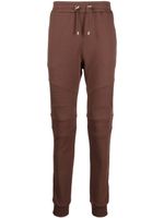 Balmain pantalon de jogging à logo imprimé - Marron