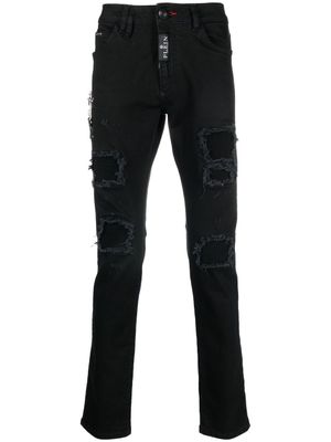 Philipp Plein jean slim à finitions effilochées - Noir