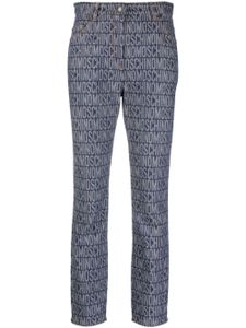 Moschino logo-jacquard high-rise slim-cut jeans - Bleu