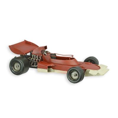 A TIN MODEL OF A FORMULA 1 RACING CAR