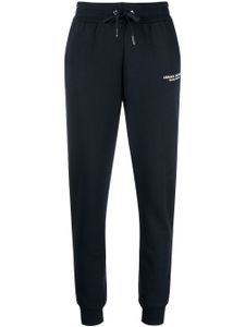 Armani Exchange pantalon de jogging fuselé à logo imprimé - Bleu