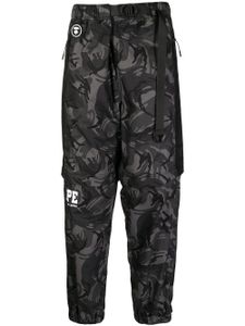 AAPE BY *A BATHING APE® pantalon fuselé à imprimé camouflage - Noir