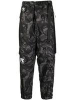 AAPE BY *A BATHING APE® pantalon fuselé à imprimé camouflage - Noir - thumbnail