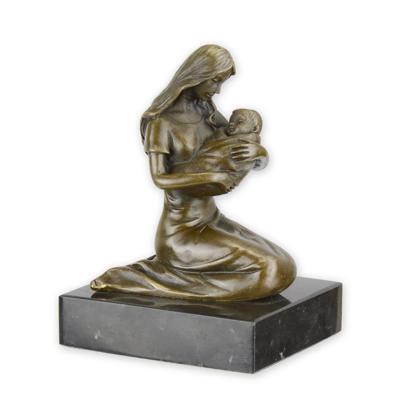 A BRONZE SCULPTURE OF A MOTHER AND CHILD