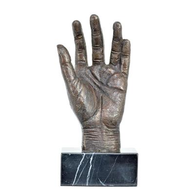 A BRONZE SCULPTURE OF A HAND