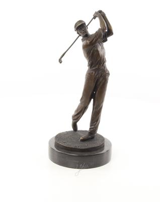 A BRONZE SCULPTURE OF A GOLFER