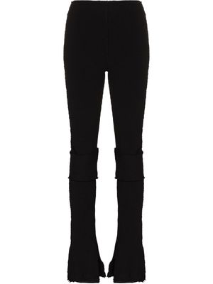 Talia Byre pantalon Warm Up évasé en maille - Noir