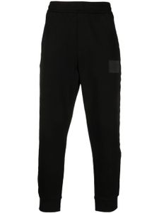 Armani Exchange pantalon de jogging en coton à patch logo - Noir