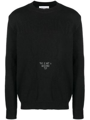 Moschino pull à slogan en intarsia - Noir