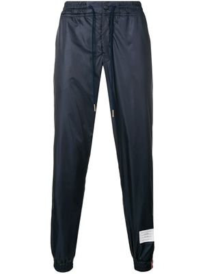 Thom Browne pantalon de jogging à détail rayé - Bleu