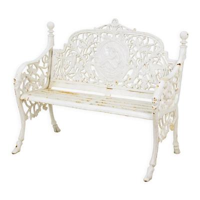 A CAST IRON GARDEN BENCH