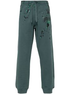 Moschino pantalon de jogging à logo imprimé - Vert