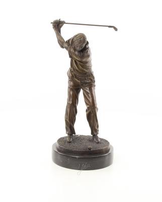 A BRONZE SCULPTURE OF A GOLFER