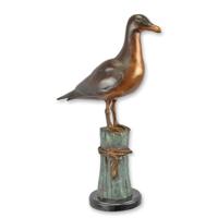 A BRONZE SCULPTURE OF A SEAGULL ON MOORING POST A BRONZE SCULPTURE OF A SEAGULL ON MOORING POST