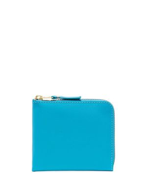 Comme Des Garçons Wallet portefeuille en cuir à fermeture zippée - Bleu