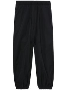 Junya Watanabe MAN pantalon fuselé à empiècements - Noir