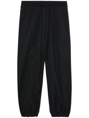 Junya Watanabe MAN pantalon fuselé à empiècements - Noir