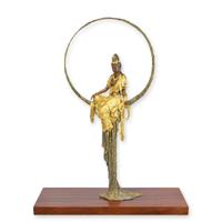 A BRONZE SCULPTURE OF A BUDDHA STTING IN A CIRCLE