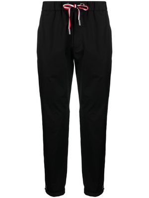 Moncler pantalon de jogging à patch logo - Noir