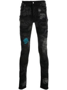 AMIRI jean skinny à finition usée - Noir