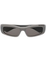 Balenciaga Eyewear lunettes de soleil à logo imprimé - Gris Balenciaga Eyewear lunettes de soleil à logo imprimé - Gris