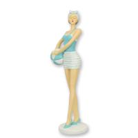 A RESIN FIGURINE OF A RETRO BEACH GIRL A RESIN FIGURINE OF A RETRO BEACH GIRL