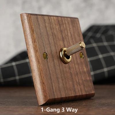 RetroLux Zwart Walnoot 1-4 Gang Wandschakelaar met Messing Toggle