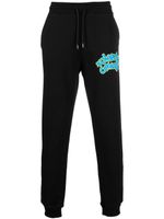 Roberto Cavalli pantalon de jogging à logo graffiti - Noir
