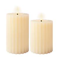 Luxe LED kaarsen/stompkaarsen - set 2x - creme wit ribbel - D7,5 x H12,5 en H15 cm - timer