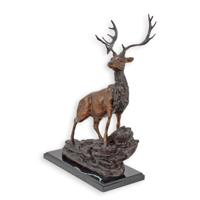 A BRONZE SCULPTURE OF A DEER ON A MARBLE BASE
