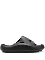 Off-White claquettes en caoutchouc à effet perforé - Noir Off-White claquettes en caoutchouc à effet perforé - Noir
