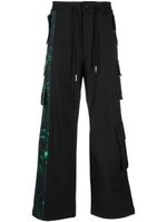 Feng Chen Wang pantalon de jogging à logo imprimé - Noir