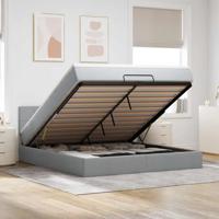 Ottoman bed met matras en LED's 160x200 cm stof lichtgrijs
