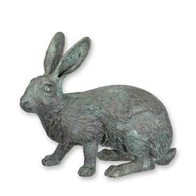 A BRONZE SCULPTURE OF A RABBIT