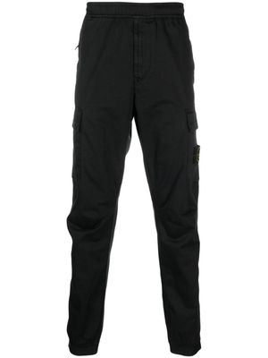 Stone Island pantalon cargo à patch Compass - Noir