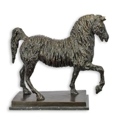 A BRONZE SCULPTURE OF A TROTTING HORSE