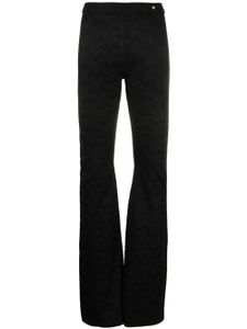 Versace pantalon évasé à motif Greca en jacquard - Noir