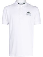 Lacoste polo à logo imprimé - Blanc