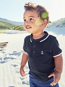 Personaliseerbare polo babyjongen met borduurwerk op de borst marineblauw